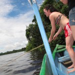 Emma catches a piranha, then runs from it screaming. (Lago Tarapoto, Colombia)